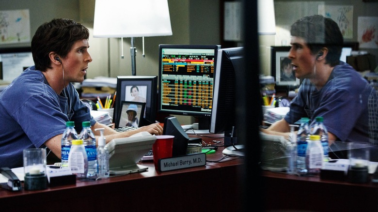 Christian Bale stares at computer