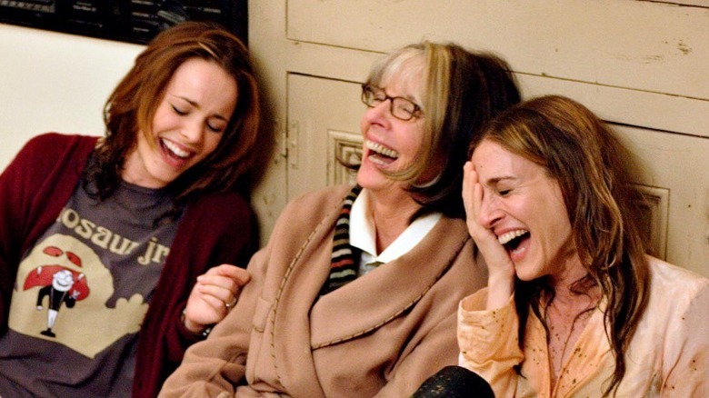 Meredith, Sybil, and Amy laughing on kitchen floor 