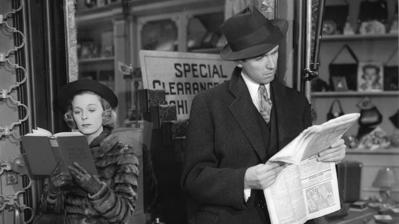 Klara with book and Alfred with newspaper