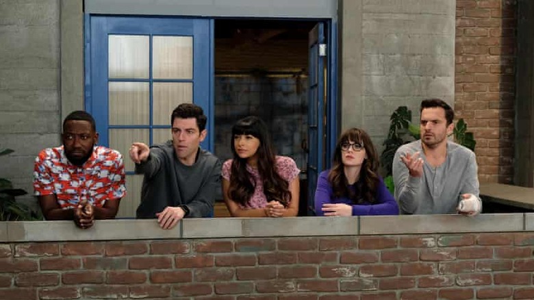 The cast of "New Girl" on loft balcony