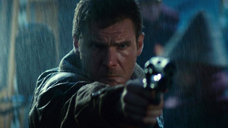 Deckard aims gun