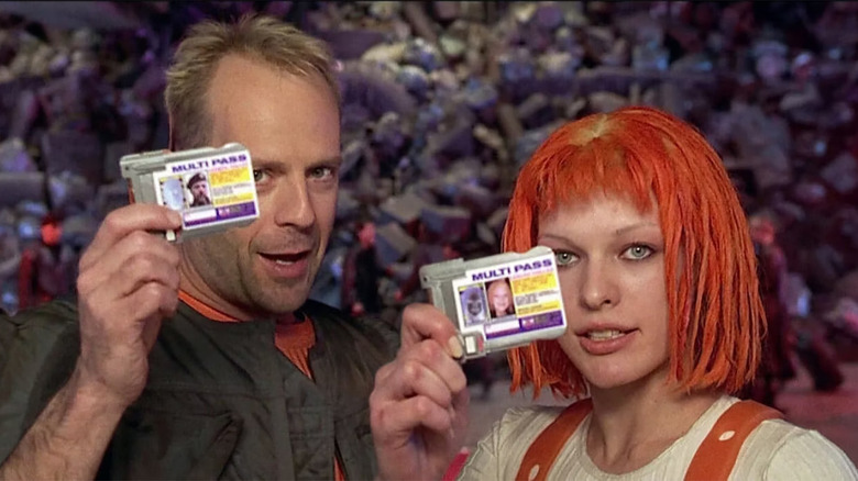 Korben Dallas and Leeloo holding multipasses in The Fifth Element