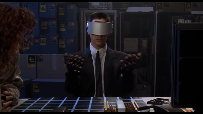 Johnny Mnemonic wears a VR headset