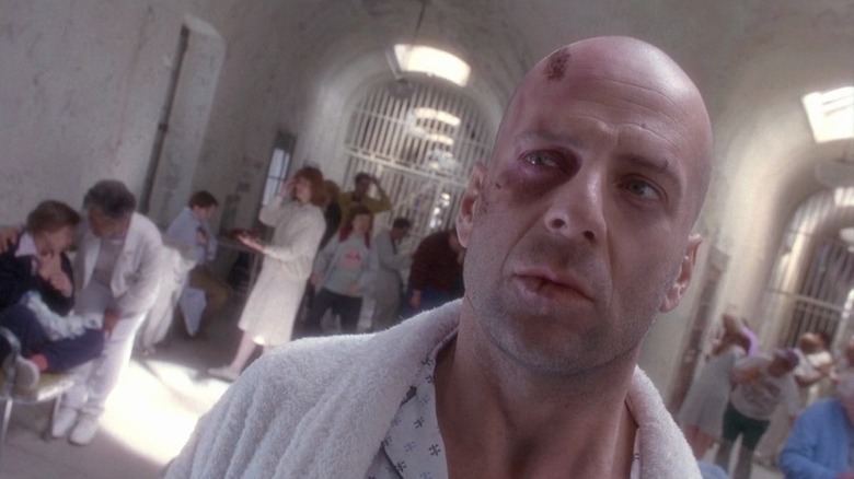 Bruce Willis wanders hall