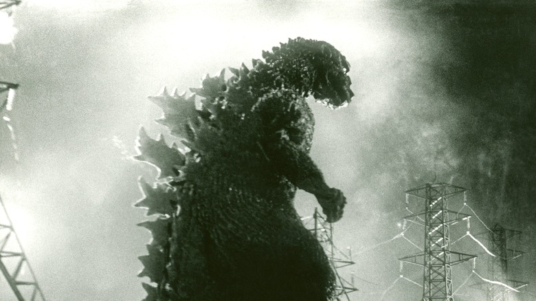 Godzilla smashes electric tower