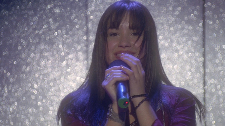 Mitchie (Demi Lovato) singing on stage in Camp Rock