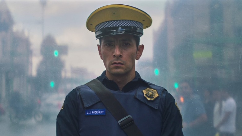 Raul Briones pretends to be a police officer in A Cop Movie