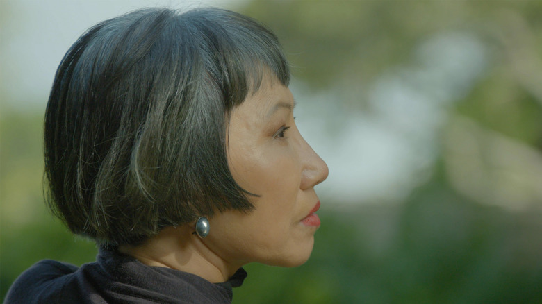 Side profile of author Amy Tan, with bob