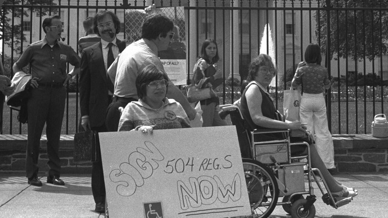 Judy Heumann protesting at The White House