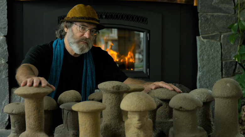 Paul Stamets touches statues in Fantastic Fungi