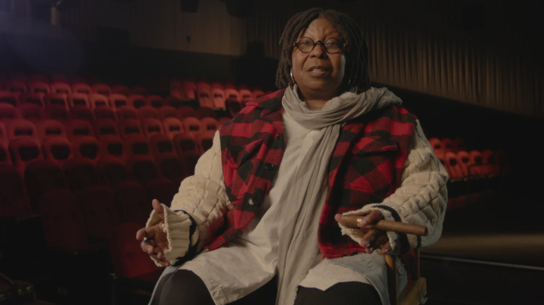 Whoopi Goldberg with a giant cigar