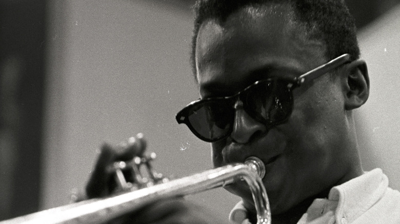 Miles Davis plays trumpet