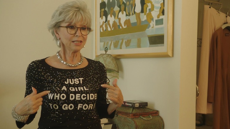 Rita Moreno wears sparkly jewelry and clothes