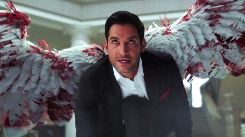 Tom Ellis as Lucifer, sprouting bloodstained wings in Lucifer