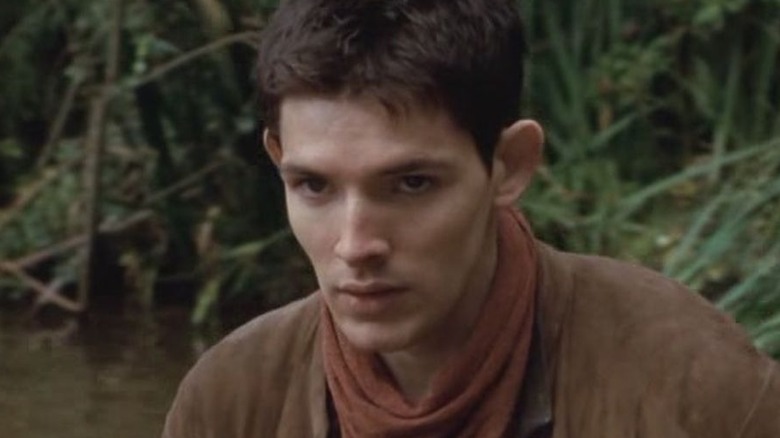 Colin Morgan as Merlin in a marsh in the TV series Merlin