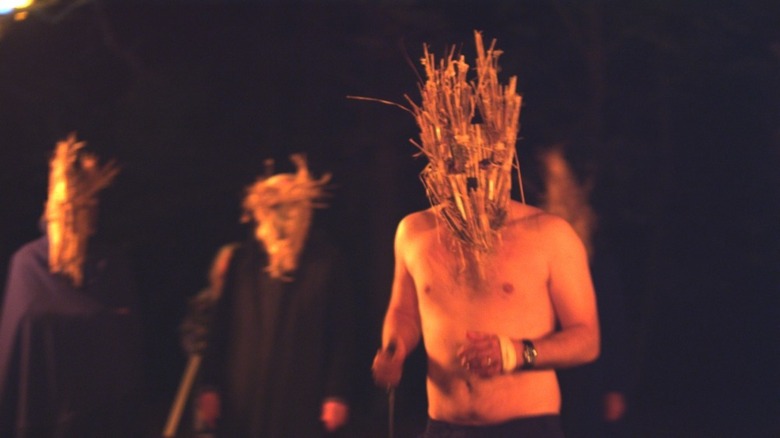 A group of people wearing masks