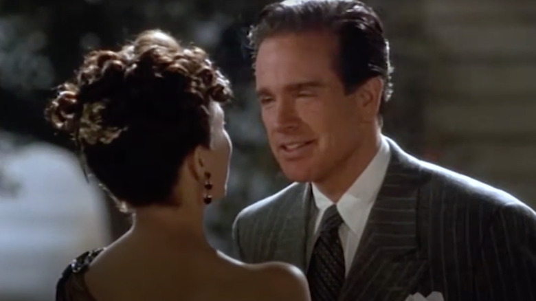 Warren Beatty as Bugsy Siegel speaks with Annette Bening as Virginia Hill in Bugsy