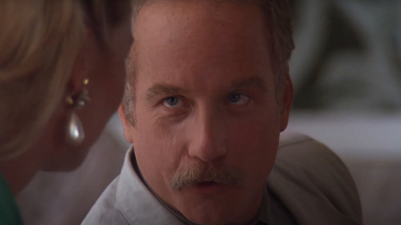 Richard Dreyfuss as Jay Trotter speaks with a woman in Let It Ride