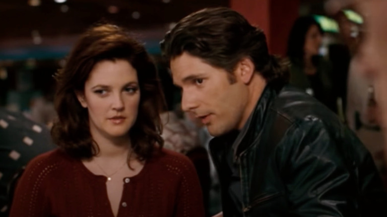 Drew Barrymore as Billie Offer and Eric Bana as Huck Cheever sit at a poker table in Lucky You