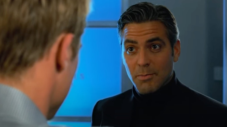 George Clooney as Danny Ocean speaks with Brad Pitt as Rusty in Ocean's Eleven.