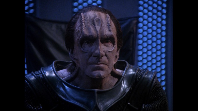 Gul Madred (David Warner) leans forward in his chair on Star Trek: The Next Generation