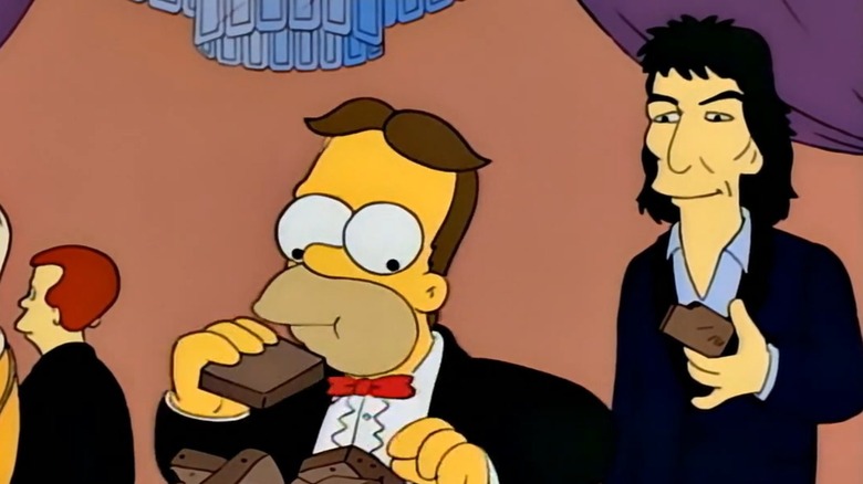 George Harrison watching Homer eat brownies on The Simpsons