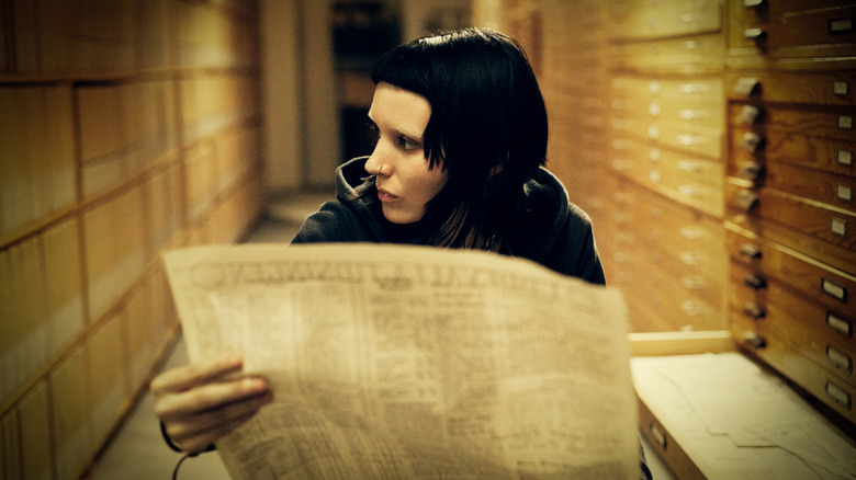 Rooney Mara looking at paper