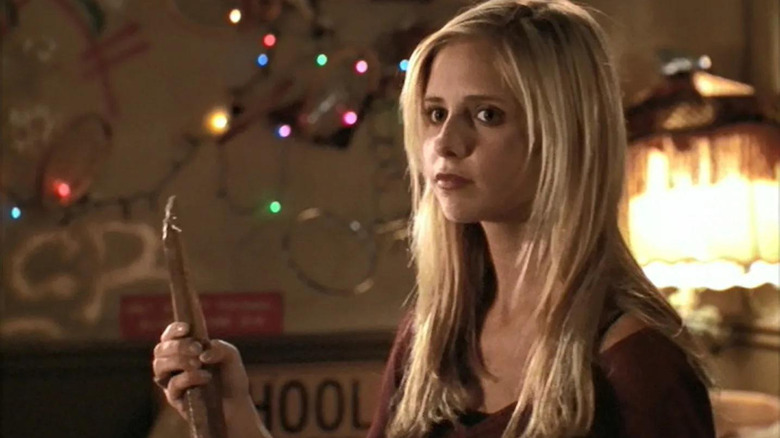 Buffy the Vampire Slayer holds a stake