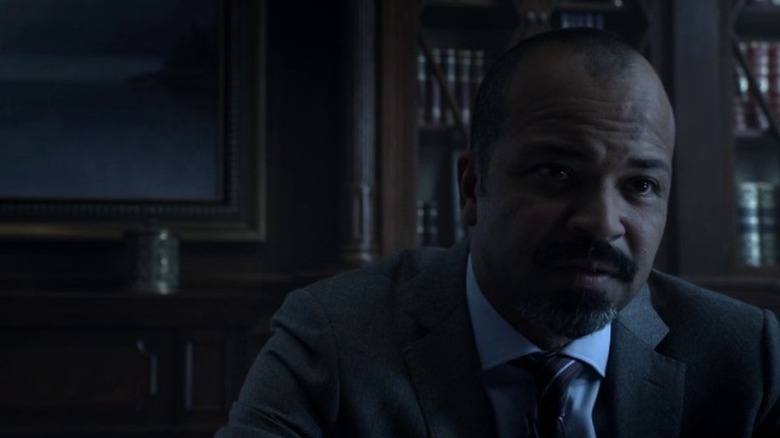 Jeffrey Wright as Dr. Walter Colfield sitting in a dimly lit office on House