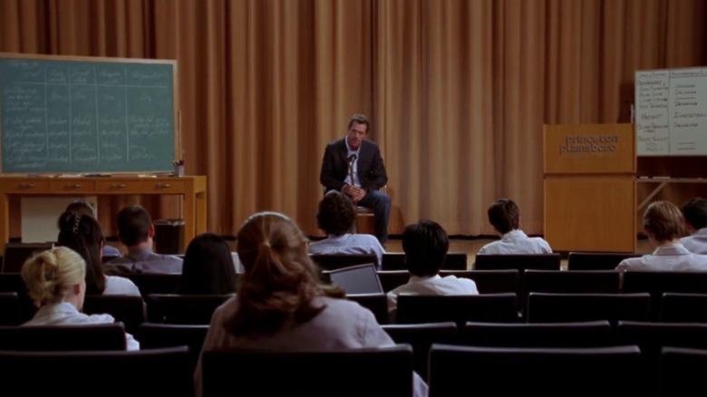 Hugh Laurie as Dr. Gregory House giving a lecture to medical students on House