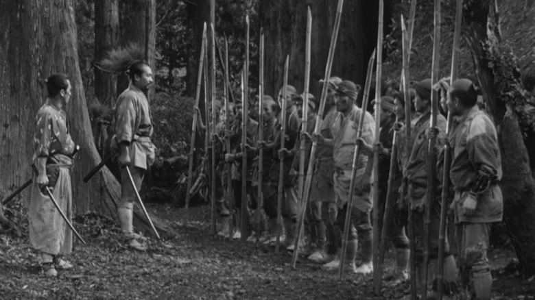 Yoshio Inaba and Seiji Miyaguchi preparing villagers for battle