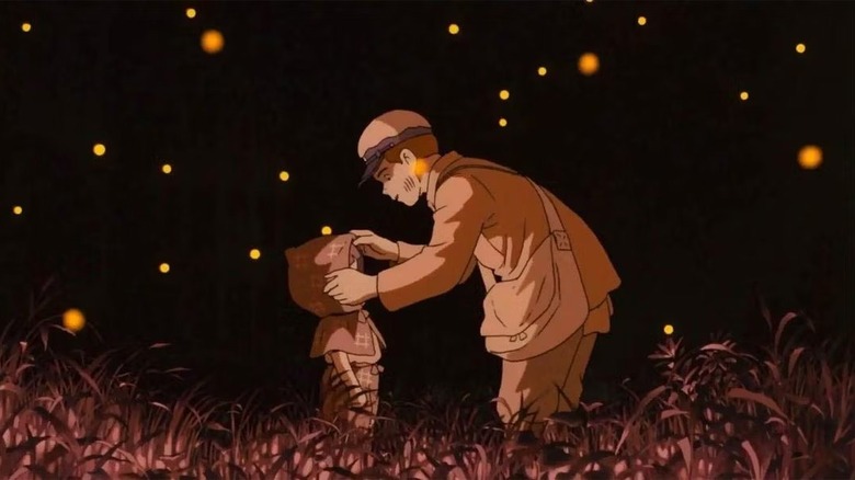 Grave of Fireflies Seita and Setsuko stand among fireflies