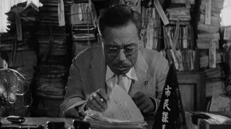 Ikiru Kanji sitting at work