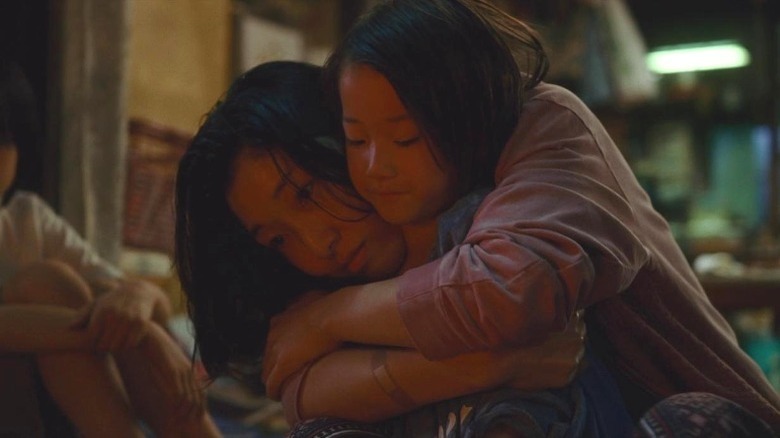 Shoplifters Aki hugs Yuri