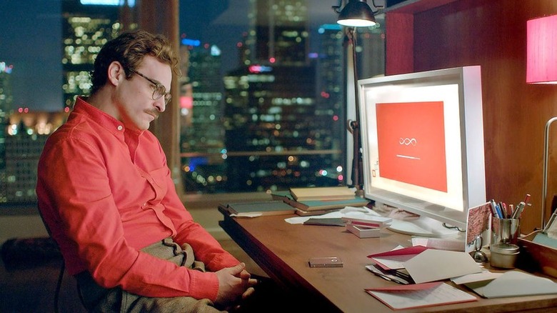 Joaquin Phoenix stares at computer