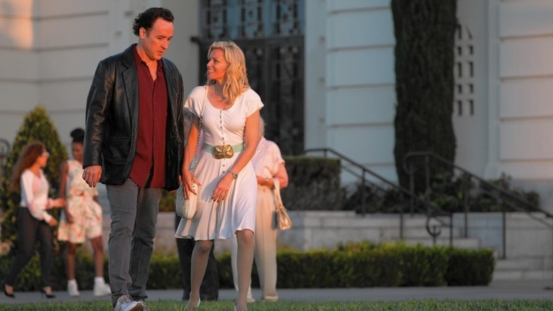 Cusack walks with Elisabeth Banks