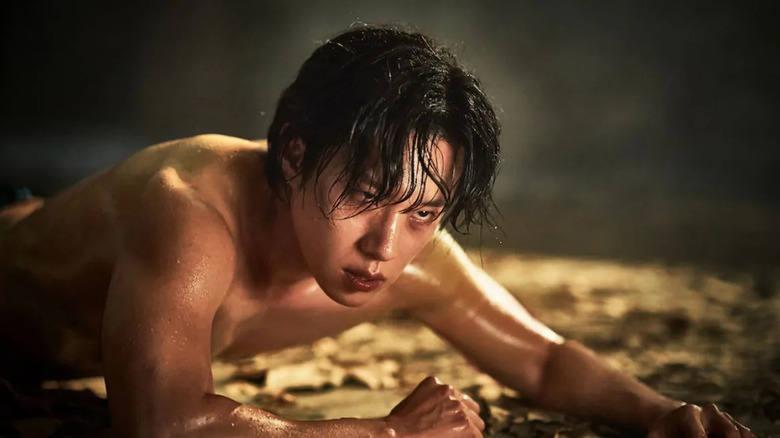 Jeong Jin-soo (Kim Sung-cheol) is resurrected naked and sweaty in Hellbound