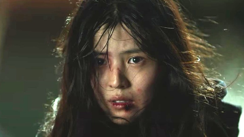 A bloodied Yoon Ji-woo (Han So-hee) looks ahead in My Name