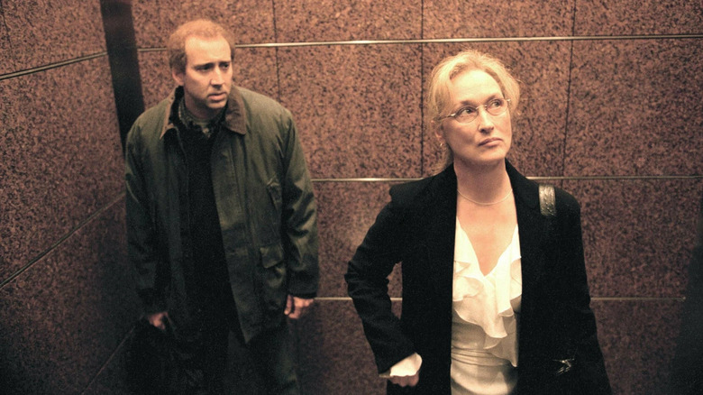 Nicolas Cage as Charlie Kaufman staring at Meryl Streep as Susan Orlean in Adaptation