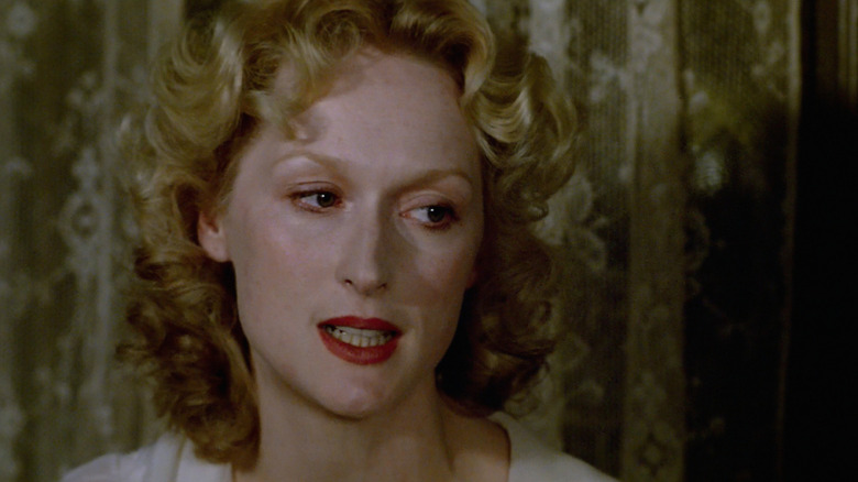 Meryl Streep as Sophie speaks with her eyes full of tears in Sophie's Choice