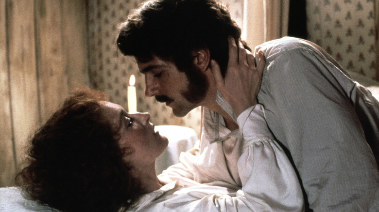 Meryl Streep as Sarah and Jeremy Irons as Charles embracing in bed in The French Lieutenant's Woman