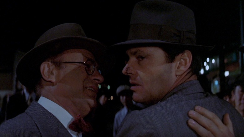 Joe Mantell and Jack Nicholson as Lawrence Walsh and J.J. Gittes walking away from the crime scene in the film Chinatown