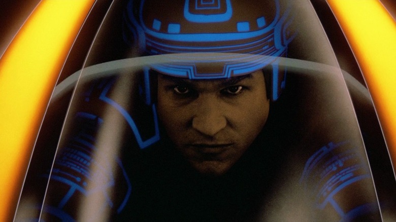 Kevin Flynn (Jeff Bridges) races for his life in a lightcycle in Tron.