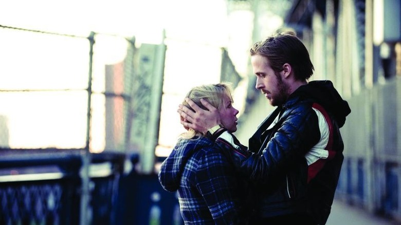 Ryan Gosling holding Michelle Williams