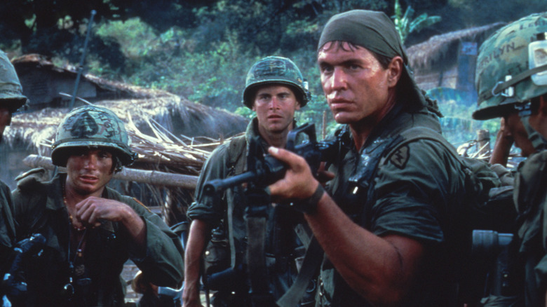 Men holding guns in Platoon