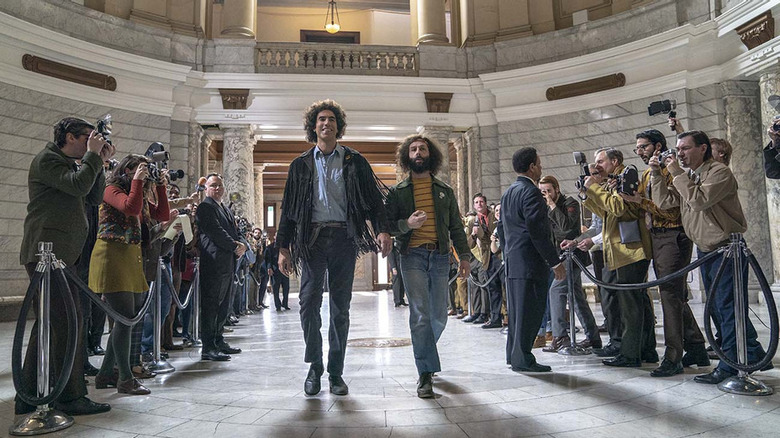 Sacha Baron Cohen and Jeremy Srrong walk court house