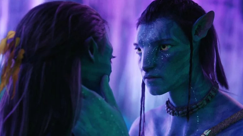 Zoe Saldana as Neytiri and Sam Worthington as Jake in Avatar.