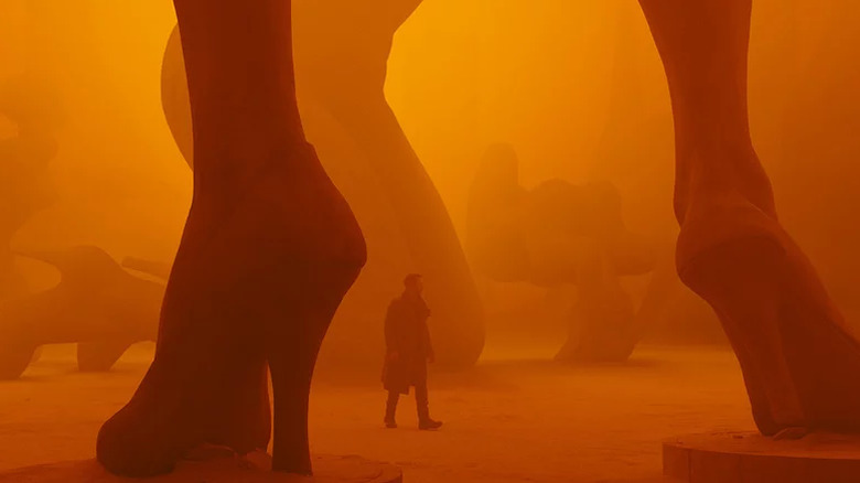 Ryan Gosling as K in a desolate Blade Runner 2049 landscape.