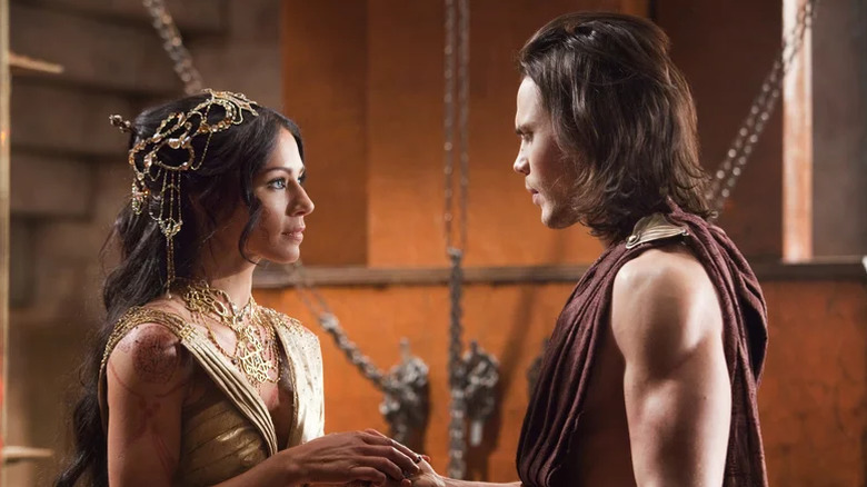 Lynn Collins as Dejah Thoris and Taylor Kitsch as John Carter.