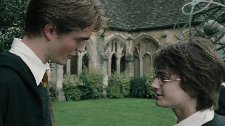 Robert Pattinson as Cedric Diggory talks to Daniel Radcliffe as Harry Potter "Harry Potter and the Goblet of Fire"